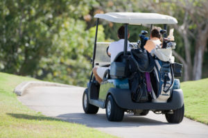 Golfers in their golf cart
